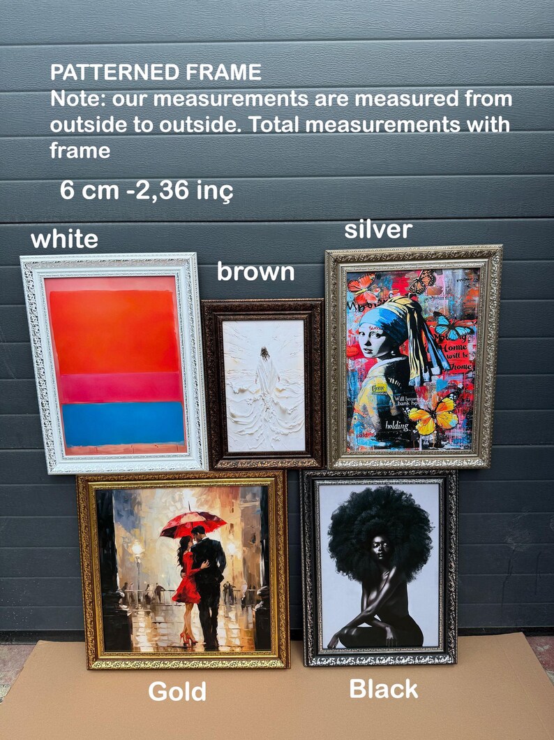 a display of framed art on a table