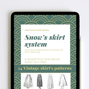 May include: A digital tablet displaying a green and gold patterned cover with the text "Snow's skirt system" and "14 Vintage skirt's patterns". The text is in a white box with a black outline. The tablet is on a white surface.