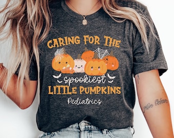 May include: A gray t-shirt with the text "Caring for the spookiest little pumpkins Pediatrics" and a graphic of smiling pumpkins with bats.