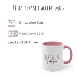 May include: A white ceramic mug with a pink rim and handle. The mug has the text "BIRTHWORK Boutique" printed on it in a pink script font. The mug is 11 ounces and is dishwasher and microwave safe. It is also lead and BPA free.