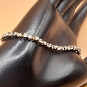 Vintage 1970s to 80s silver and Cubic Zirconia tennis bracelet.