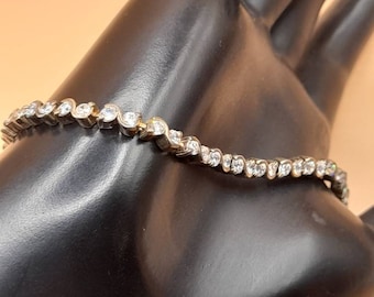 Vintage 1970s to 80s silver and Cubic Zirconia tennis bracelet.