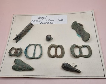 Display of 15th Century Metal Tudor Studs and Buckles.