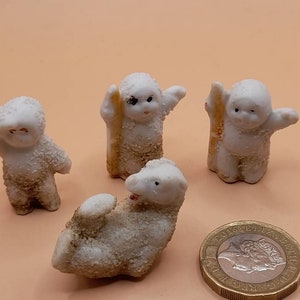 1920s 4 x cake decoration toppers bisque snow babies and polar bear.