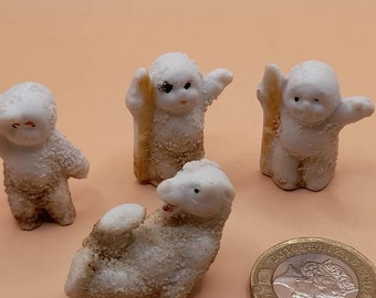 1920s 4 x cake decoration toppers bisque snow babies and polar bear.