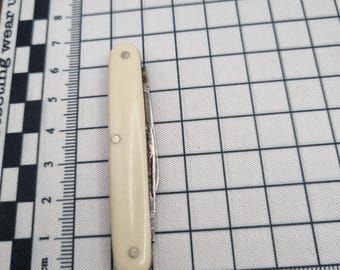 Vintage Sheffield stålverktyg med benhandtag.