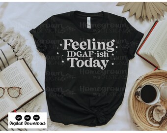 May include: Black t-shirt with white text that reads "Feeling IDGAF-ish Today" with stars around the text.
