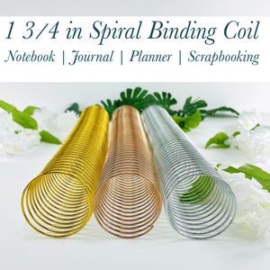 May include: Three 1 3/4 inch spiral binding coils in gold, rose gold, and silver. The coils are arranged in a row on a white surface.