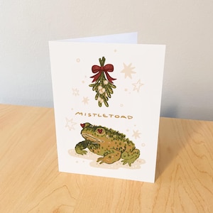 Kiss Me Under the Mistletoad Greeting Card 4.25x5.5” (Happy Holidays / Merry Christmas, mistletoe funny toad frog illustration handmade)