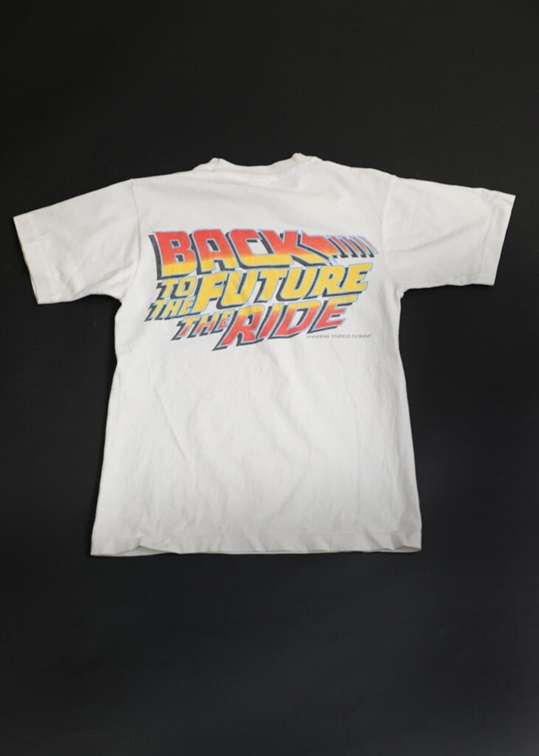 【70％OFF】 90's Studios Universal T-shirt Ride Future the to Back トップス