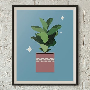 May include: A framed art print depicting a potted plant with large green leaves against a light blue backdrop. The pot is a muted pink with a decorative band. Two white starbursts are in the background.