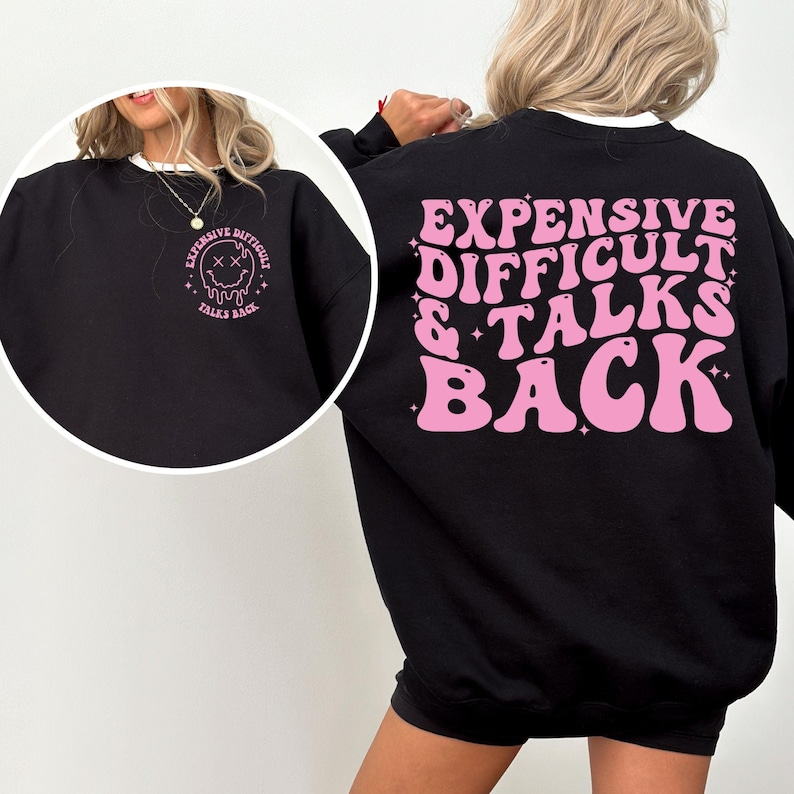 May include: Black sweatshirt with a pink graphic on the back that says "Expensive Difficult & Talks Back" in a retro font. The graphic also includes stars and glitter.