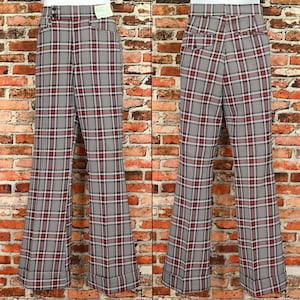 May include: A pair of wide-legged pants with a red and black plaid pattern. The pants have a high waist and a flared leg.