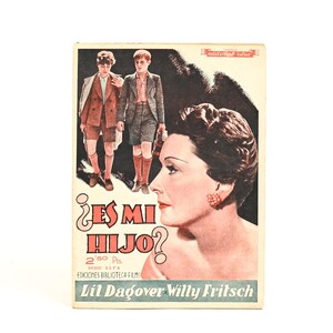 May include: Vintage movie poster featuring a woman's profile and two young boys in suits. The poster has the title "¿Es Mi Hijo?" in large letters, with the names Lil Dagover and Willy Fritsch at the bottom. The color palette includes red, brown, and cream.