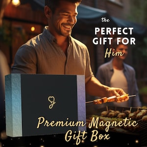 A man is holding a box with a logo on it, and there is another man grilling food in the background. The text overlay on the image reads "the PERFECT GIFT FOR Him Premium Magnetic Gift Box".
