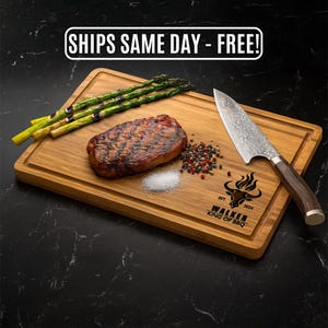 May include: A wooden cutting board with a grilled steak, asparagus, salt, and peppercorns. A large knife rests on the board. The board has the text "WALKER KING OF BBQ" and a bull logo.