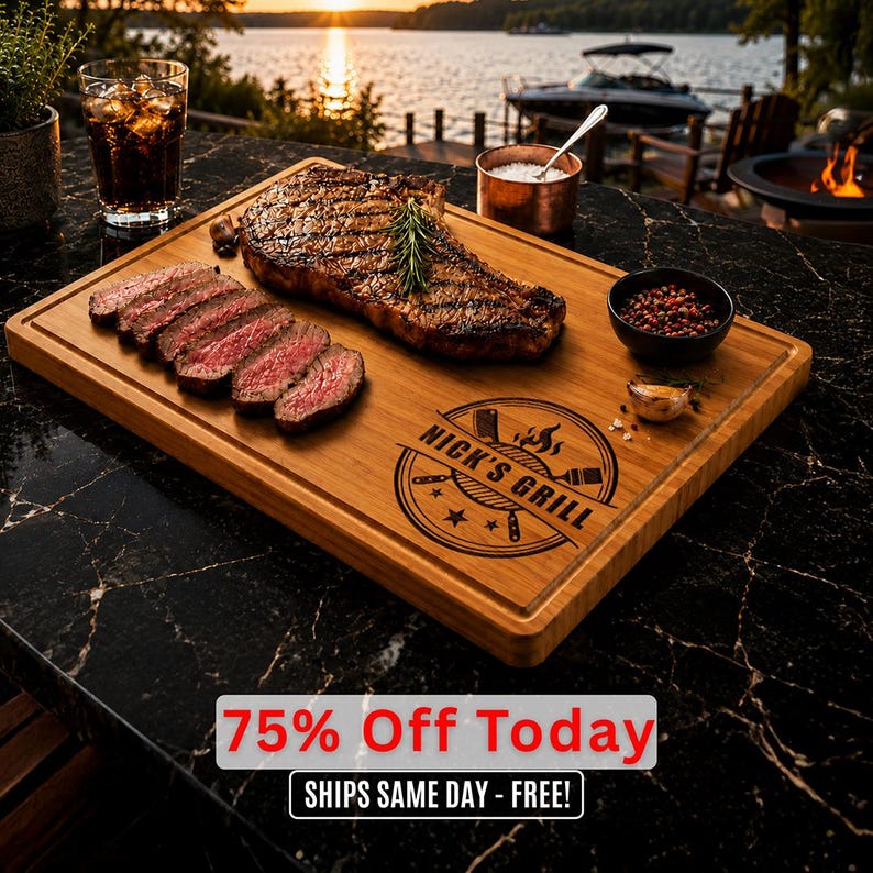May include: A wooden chopping board with a grilled steak and sliced steak. The board has a carved border and the text "Nick's Grill" in a circular design. A glass of cola, a small bowl of peppercorns, and a copper bowl of salt are also present.