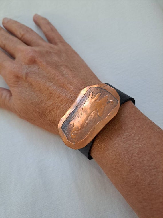 Copper etched dog brooch/black leather snap cuff