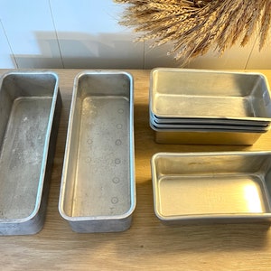 collection of vintage cake pans, pie plates & bread loaf baking