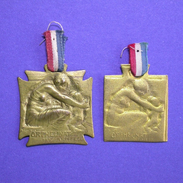 Pair of French René Lalique WW1 National War Orphans Day Badges