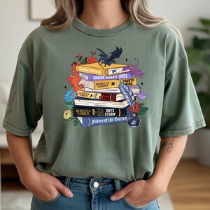 Dragon rider universe themed Comfort Colors tee
Cozy fantasy book aesthetic dragon lover shirt
Gift for book lovers dragon rider graphic tee
Vintage style romantasy dragon themed t-shirt
Bookish fantasy dragon rider apparel Comfort Colors shirt