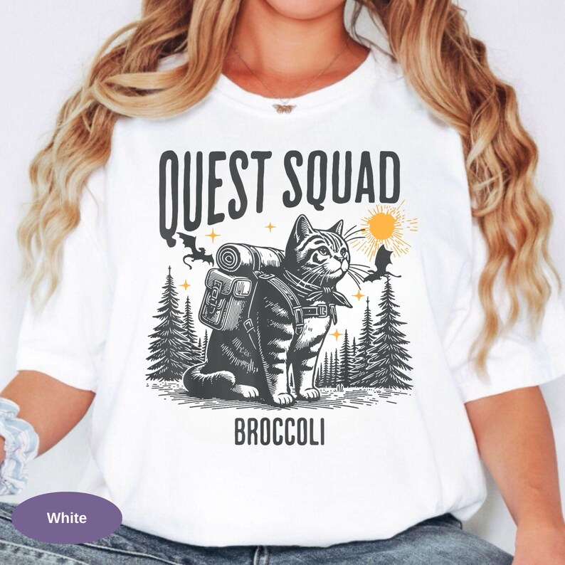 Quirky fantasy reader Comfort Colors apparel
Ridoc inspired funny fantasy themed t-shirt
Book lover broccoli cat graphic shirt
Dragon rider inspired humorous fantasy tee
Cute fantasy cat shirt for romantasy fans
Vintage style Quest Squad broccoli cat tee