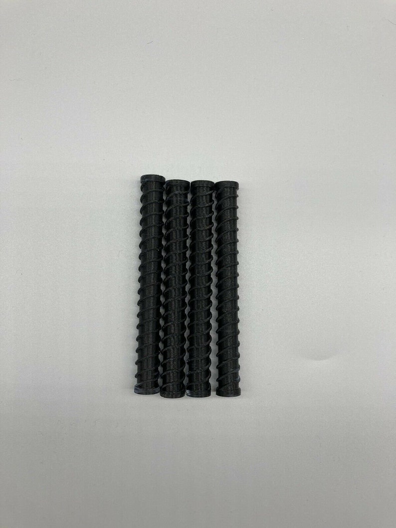 May include: Four black, spiral-shaped, plastic tubes.