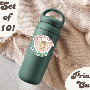 May include: A set of 10 green water bottles with a pink and white sticker that says "One Loved Teacher" with a pencil and lightning bolt design. The text "Set of 10!" and "Print & Cut!" are also visible in the image.