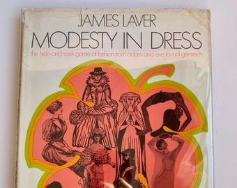 May include: A book cover featuring a pink, yellow and green leaf design. The book title is "Modesty in Dress: The hide-and-seek game of fashion from Adam and Eve to Rudi Gernreich" by James Laver.