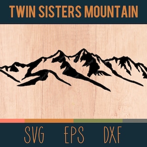 May include: Black silhouette of a mountain range with the text "Twin Sisters Mountain" above it. The image is on a woodgrain background with the words "SVG", "EPS", and "DXF" below the mountain range.
