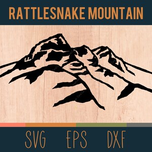 May include: Black and white silhouette of a mountain range with the text "RATTLESNAKE MOUNTAIN" above it.