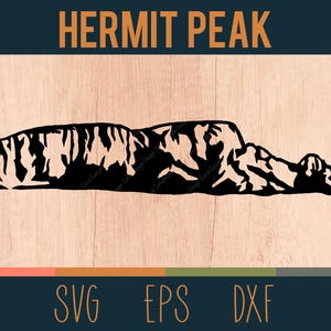 May include: Black silhouette of Hermit Peak mountain range on a light wood grain background. The text "HERMIT PEAK" is above the mountain graphic. Below the mountain graphic are the letters "SVG EPS DXF".