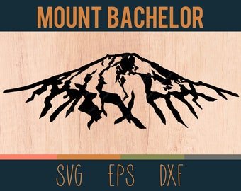 May include: Black silhouette of Mount Bachelor with the text "MOUNT BACHELOR" above it. Below the mountain are the letters "SVG EPS DXF" in white. The background is a light wood grain.