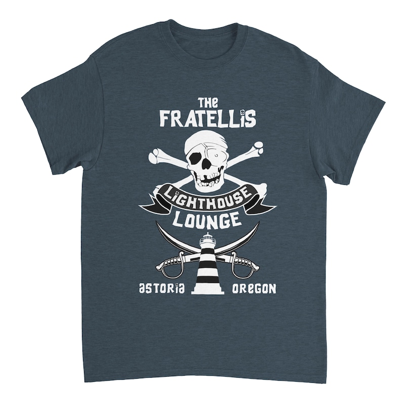 May include: A blue t-shirt with a white graphic design featuring a skull and crossbones, a lighthouse, and the text "The Fratellis Lighthouse Lounge Astoria Oregon".