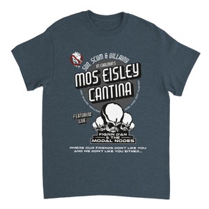 May include: A dark blue t-shirt with a graphic design. The design features the text "Mos Eisley Cantina" and "Sun, Scum & Villainy" with skull imagery. The shirt also includes the text "Featuring Live Figrin D'an & The Modal Nodes."