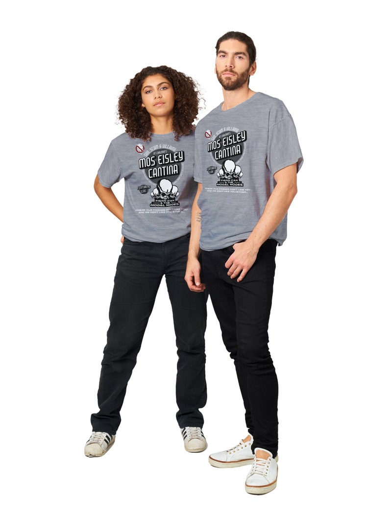 May include: Two people wearing gray t-shirts with the text "Mos Eisley Cantina" and a graphic of skulls. The shirts are paired with black jeans and white sneakers. The image is set against a white background.