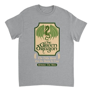 May include: A heather gray t-shirt with a green dragon graphic and the text "the GREEN Oragon" in a vintage style font. The text below the dragon reads "The Only Brew for the Brave & True" and "Bywater, The Shire".