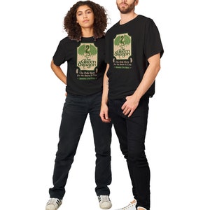 May include: Two people wearing black t-shirts with a green dragon graphic and the text "The Green Dragon" and "The Only Brew for the Beast & Crew".