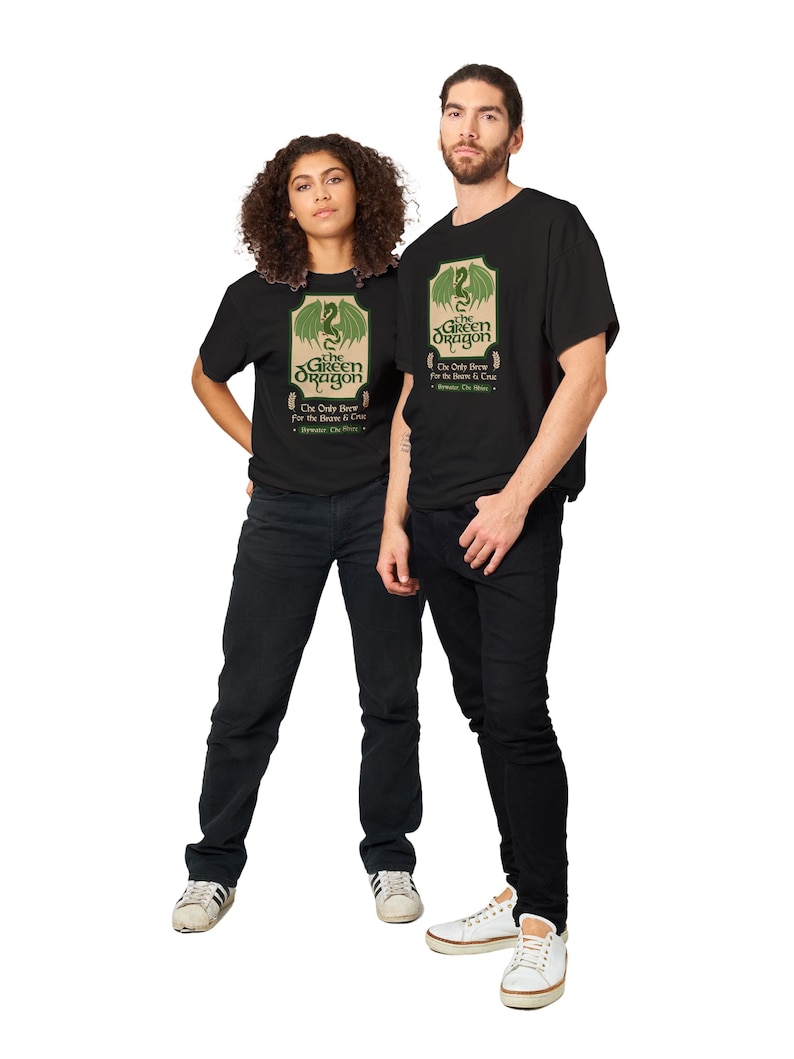 May include: Two people wearing black t-shirts with a green dragon graphic and the text "The Green Dragon" and "The Only Brew for the Beast & Crew".