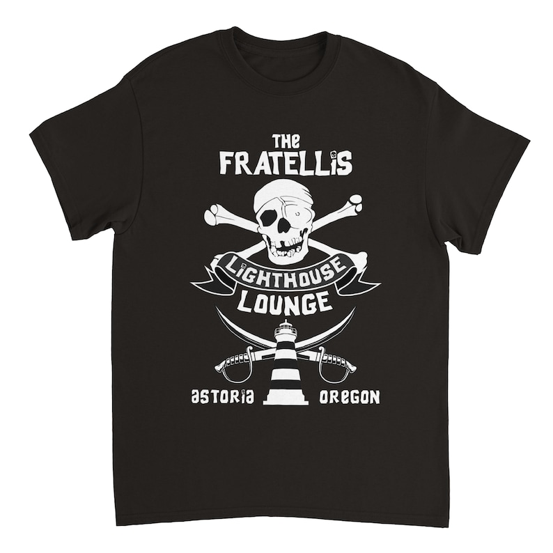 May include: Black t-shirt with a white graphic design featuring a skull and crossbones, a lighthouse, and the text "The Fratellis Lighthouse Lounge Astoria Oregon".