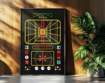 May include: Black framed poster featuring a retro video game graphic. The design includes a yellow grid, red lines, and various colored icons. The text "SHIELD" and "027380" are visible. A houseplant is in the background.