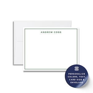 a white card with a green border, and there is a blue envelope with a white label on it.
