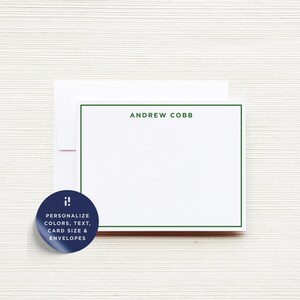 May include: A white stationery card with a dark green border and the name ANDREW COBB printed in dark green capital letters. A white envelope is positioned behind the card. A dark blue circular sticker features the text: i! PERSONALIZE COLORS, TEXT, CARD SIZE & ENVELOPES.