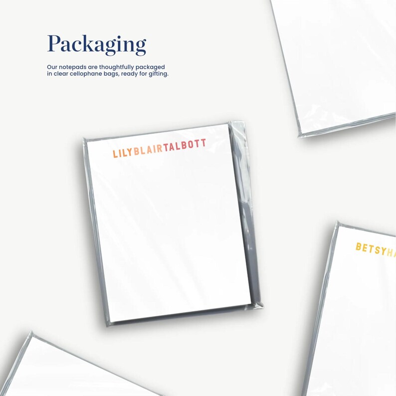 several white pieces of paper or cards, each with a different color or design, arranged in a collage-like manner.