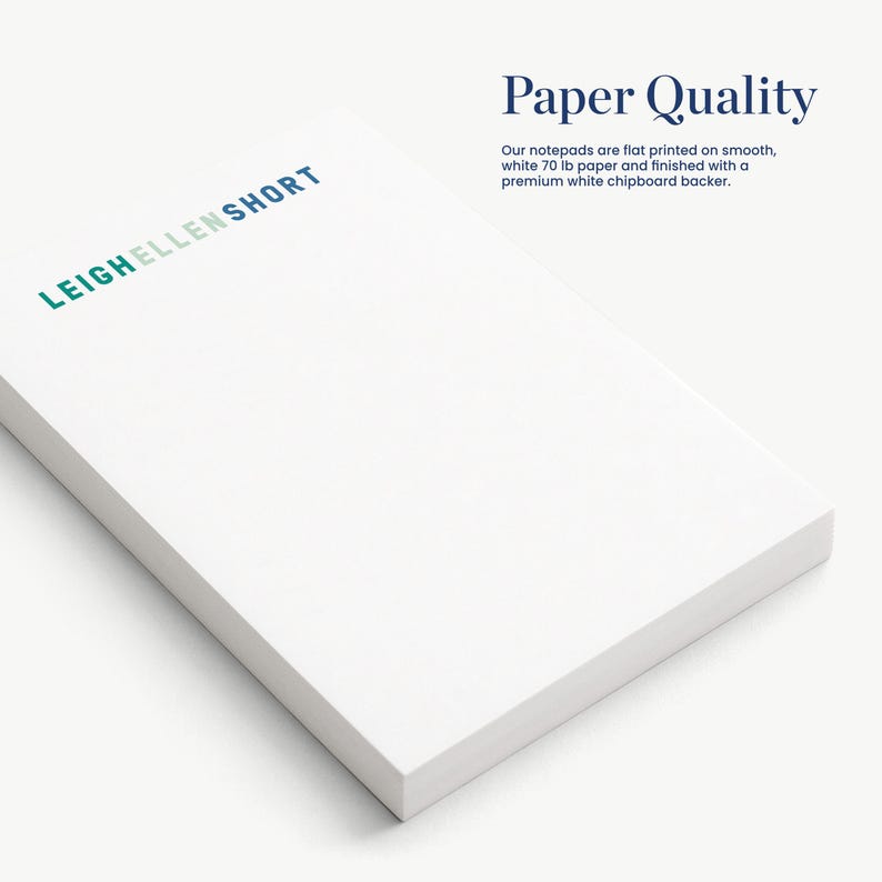 a close-up view of a white notepad with the text "Paper Quality" printed on it.