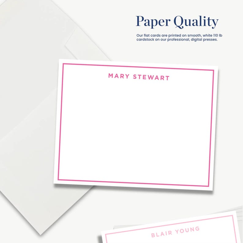 The image is a white card with a pink border, featuring the names "Mary Stewart" and "Blair Young" printed on it. The card is placed on a white background, and there is a white envelope in the background as well.