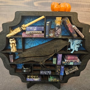 Mensola in miniatura della scuola di magia Raven House