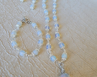 Wire wrapped opalite pendant on a beaded necklace with bracelet and earrings