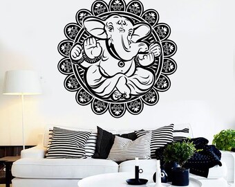 May include: Black and white wall decal featuring a stylized image of Ganesha, the Hindu god of wisdom and prosperity, sitting in a meditative pose within a circular mandala design.