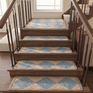 May include: A set of rectangular stair treads made from woven natural jute fiber, featuring a repeating diamond pattern in light blue and tan. Each tread is designed to lay flat on wooden steps, providing a textured surface with blue borders.
